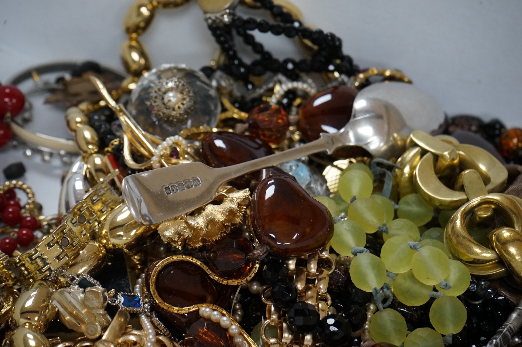 A quantity of assorted recent costume jewellery and two silver handled button hooks.